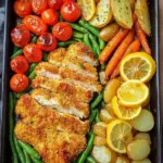 Panierte Parmesan H&auml;hnchenschnitzel aus dem Ofen mit Gem&uuml;se und Kartoffelecken